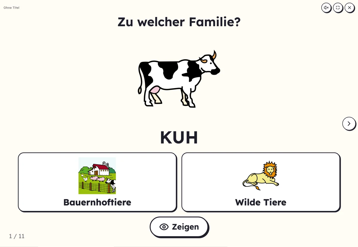 Zu welcher Familie? am Bildschirm: eine Katze und die Kisten für Tiere und Obst