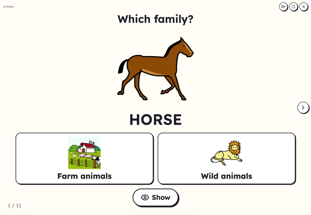 Which family? on screen: a cat and the boxes for animals and fruit